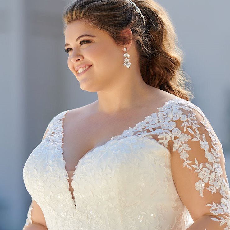 Model wearing a plus size bridal dress